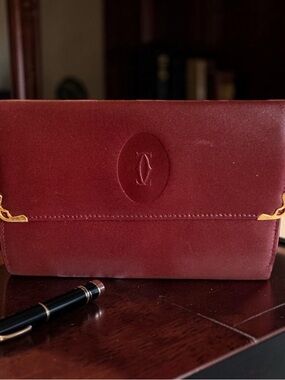 Cartier Wine Red Leather Wallet with Gold Corners
